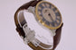 Optima Herren-Armbanduhr mit römischen Ziffern und Strassbesatz